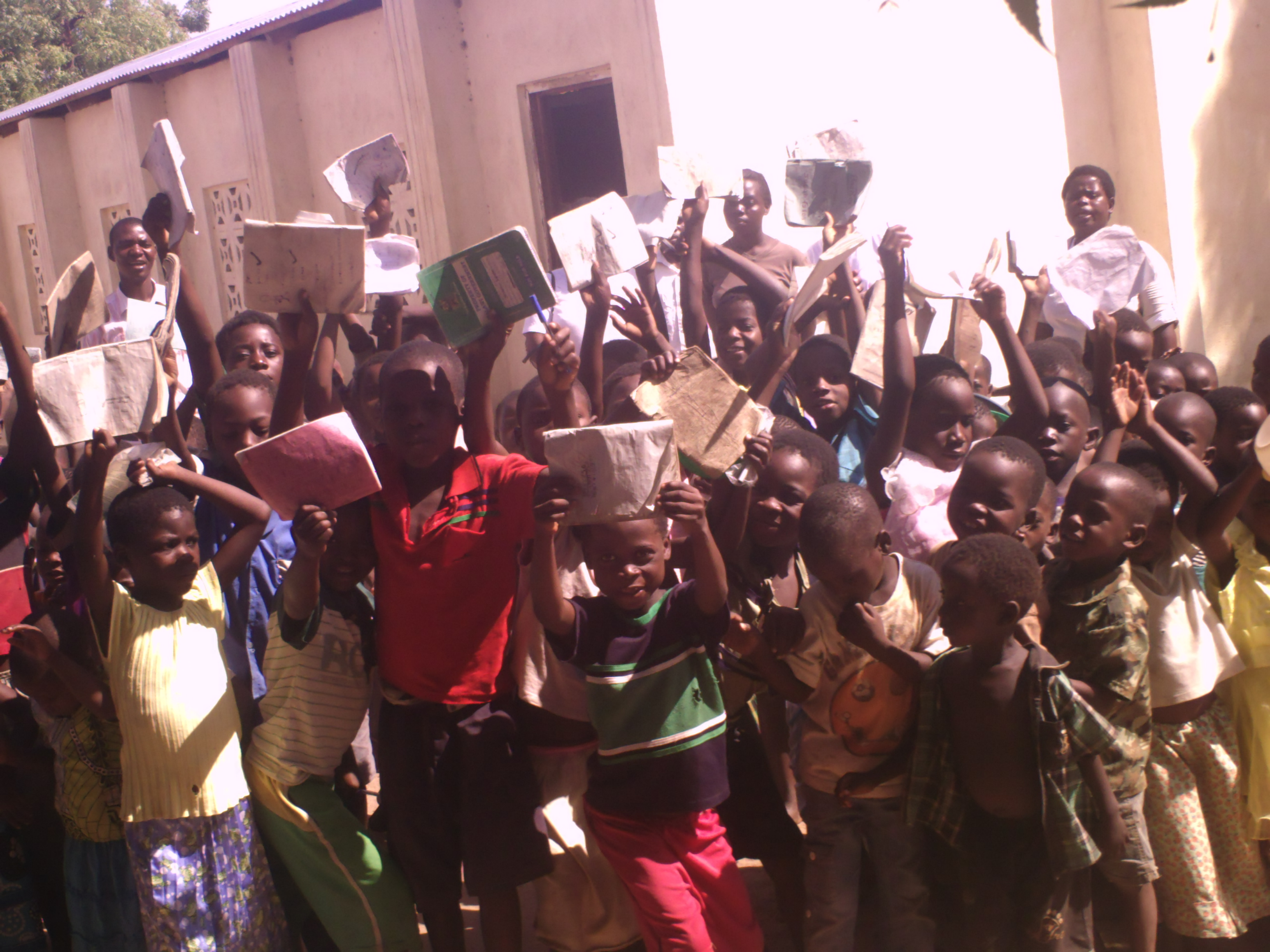 Picture of teachers and the students and the feeding program and classes
